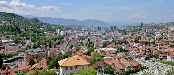 Sarajevo overlooking the city from a cemetery made filled from the Bosnian War OS OC 