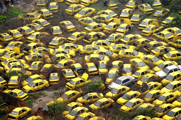 Scrapped taxis outside Chongqing China As the middle class grows more and more families are buying private cars for the first time 