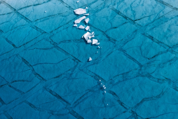Shards of ice float in a shallow lake atop the Greenland ice sheet east of Ilulissat Daniel Beltra 