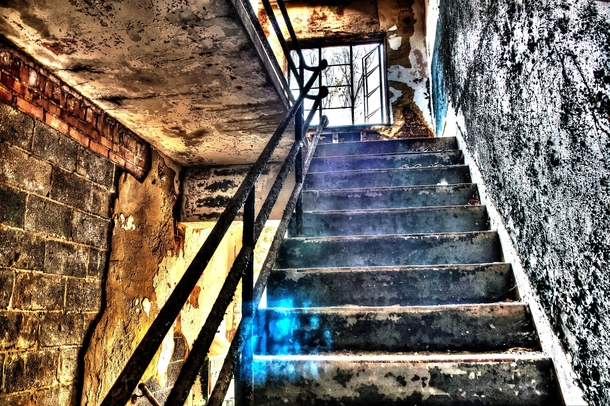 Shot this in an abandoned mental hospital in Maryland When I edited it to create an HDR image the blue orb became visible it isnt in any of the images I combined to create this image Immediately after editing this photo when I saved the next image it save