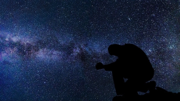 Silhouette Of A Man Under The Stars And Galaxy Image