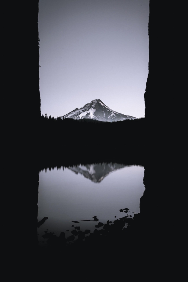 Silhouettes and Mt Hood reflecting on Frog Lake in Oregon 