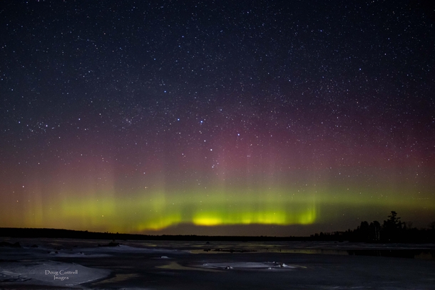 Single Exposure of the Aurora Borealis with a faint glimmer of the Milky Way above it Northern Minnesota March 