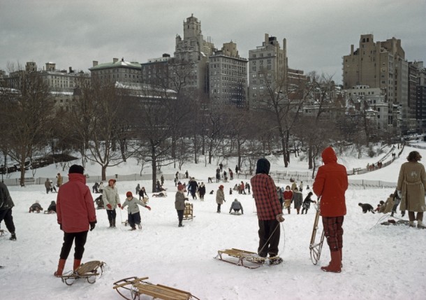 Sledders clamber up a snowy hill in Central Park December   source in comments