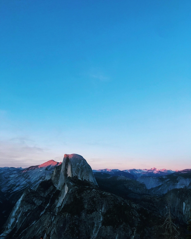 Snapped this at Glacier Point in Yosemite National Park at sunset I dont think Ill ever get over how gorgeous these mountains are 