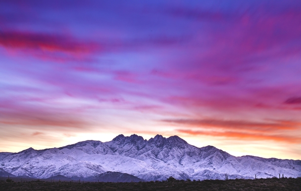 Snow capped Four Peaks during sunrise 