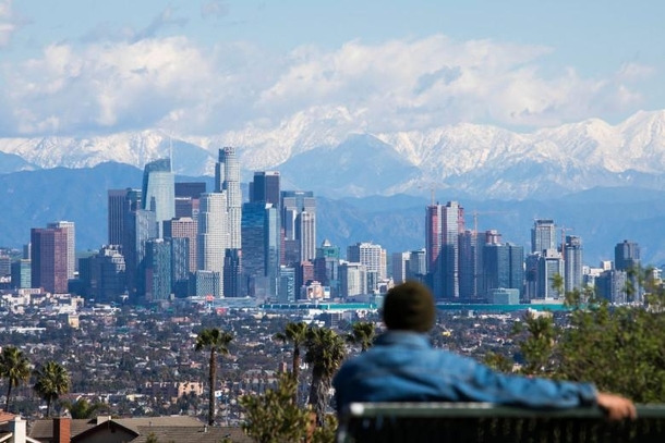 Snow covered mountains behind downtown Los Angeles California