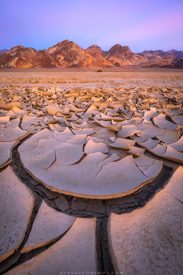 Soft evening light on the now infamous mud cracks of Death Valley CA 