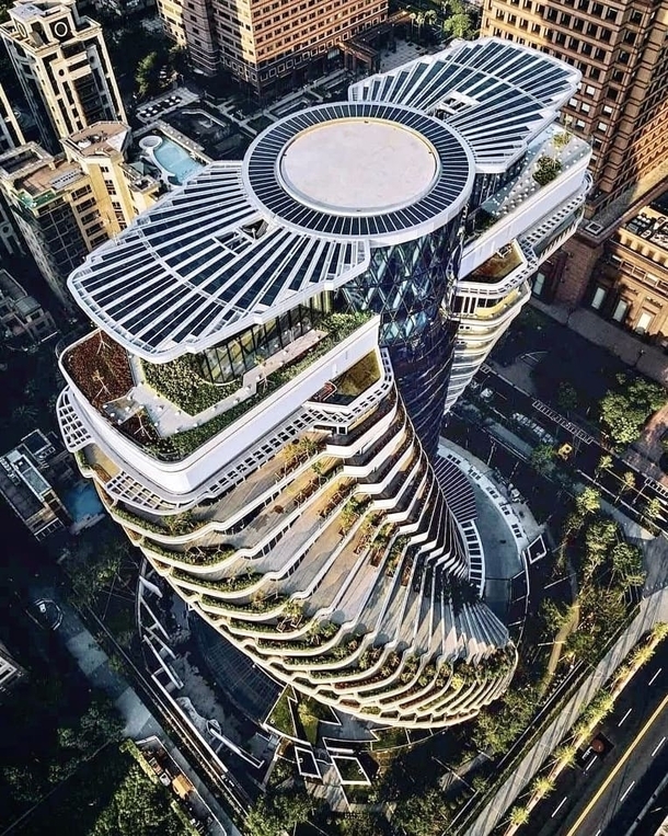 Some four years after it was originally due to be completed and over a decade after first being commissioned Vincent Callebauts twisting Tao Zhu Yin Yuan aka Agora Garden Tower in Taipei Taiwan