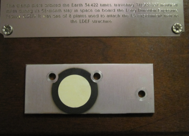 Something a bit different A clamp plate that spent time in orbit My grandpa was head of NASAs Applied Materials Branch At some point during his career he was given this You all might appreciate it Its a little hard to read the full text is in the comments