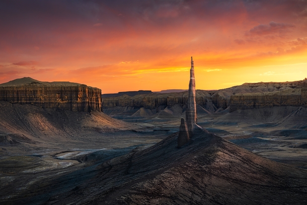Spire rising in the desolate badlands of Utah captured during a spectacular sunset 