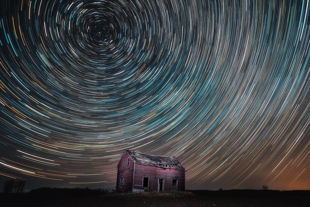 Star trails over an old house in Ontario Canada garycphoto