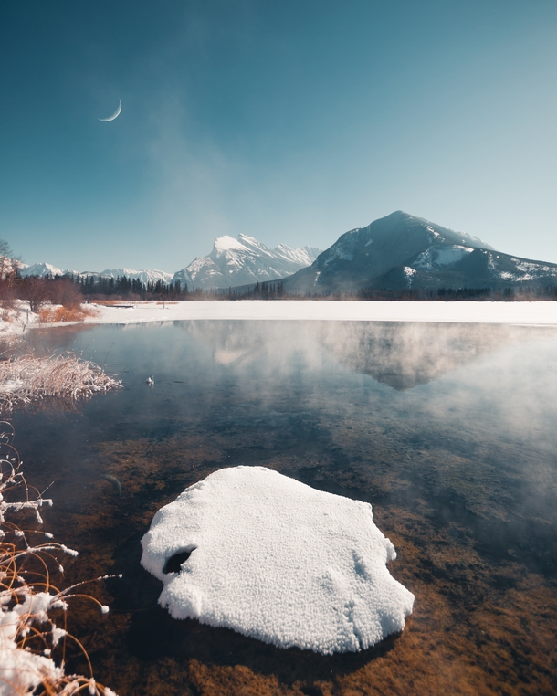 Steam rises from Vermillion Lakes in Banff Alberta 