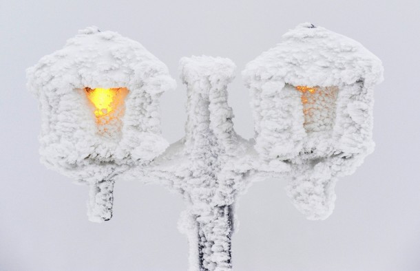 Street lights coved in snow and ice Feldberg mountain Germany 