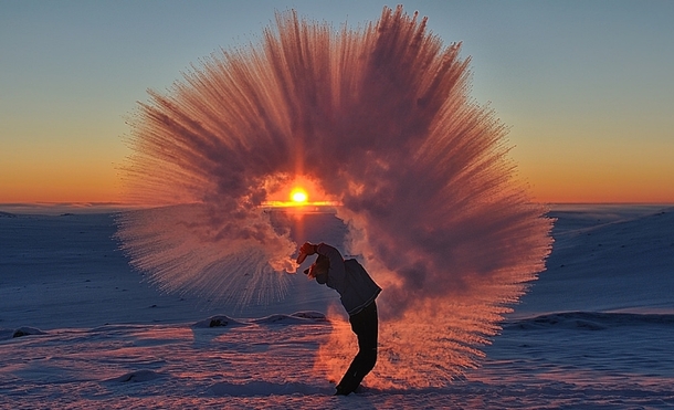 Stunning Shot Captures Man Flinging a Thermos of Hot Tea in Subzero Temperatures 