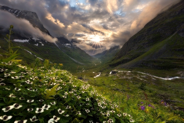 Sun breaking through the clouds over Innerdalen Norway  Photo by Haakon Nygrd