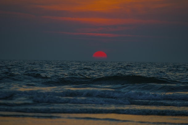 Sun setting over the horizon in Arabian sea
