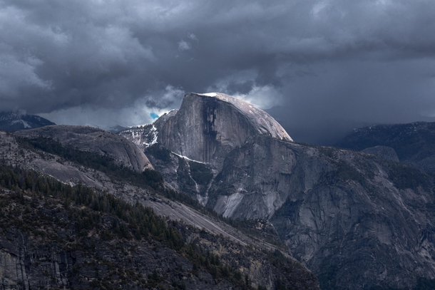 Sunlight on Half Dome during a thunderstorm 