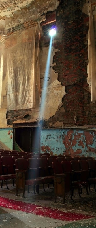 Sunlight streams through a broken window in an old vaudeville theatre Toronto Ontario Canada 
