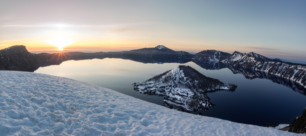 Sunrise hits Wizard Island and Crater Lake after a night spent watching the Milky Way traverse overhead 