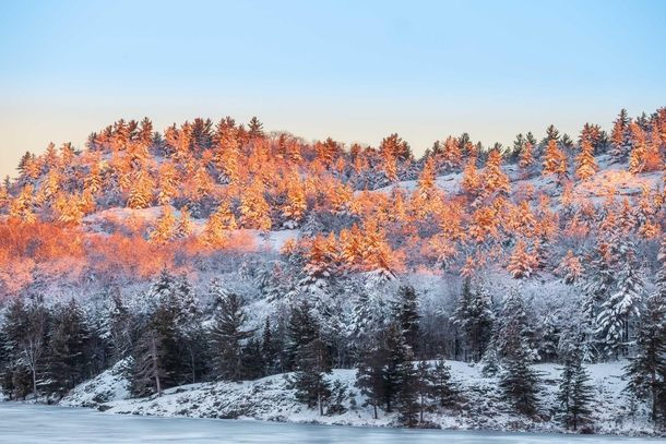 Sunrise lighting up some frozen Canadian wilderness Killarney Provincial Park Canada  Social mikemarkov