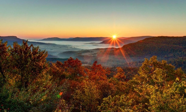 Sunrise over fall colors in the Buffalo National River Valley Arkansas 