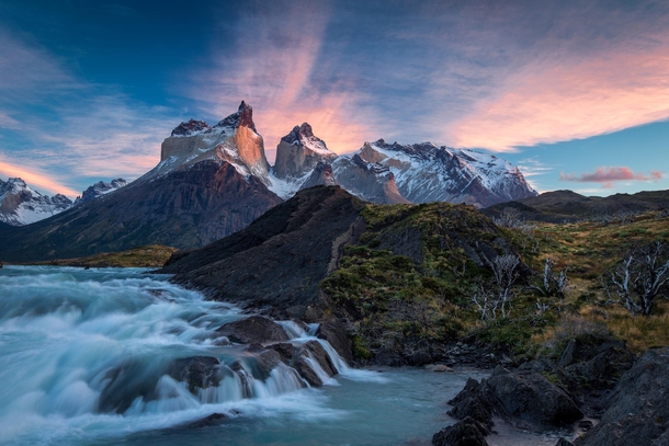 Sunrise over the Salto Grande cascades with the Cuernos del Paine mountains - in Torres del Paine national park Chile  by Jim Reitz