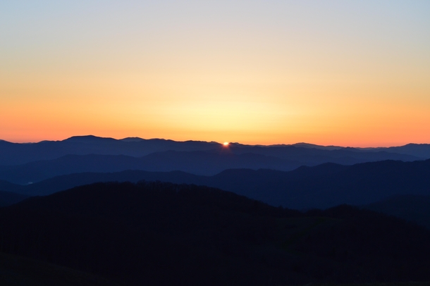 Sunrise peaking over the Blue Ridge Mountains Max Patch NC 