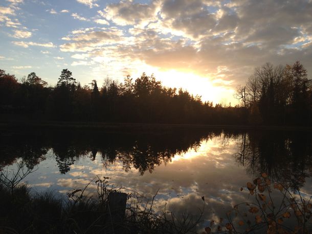 Sunset on a small pond at Huron National Forest Mio MI USA 