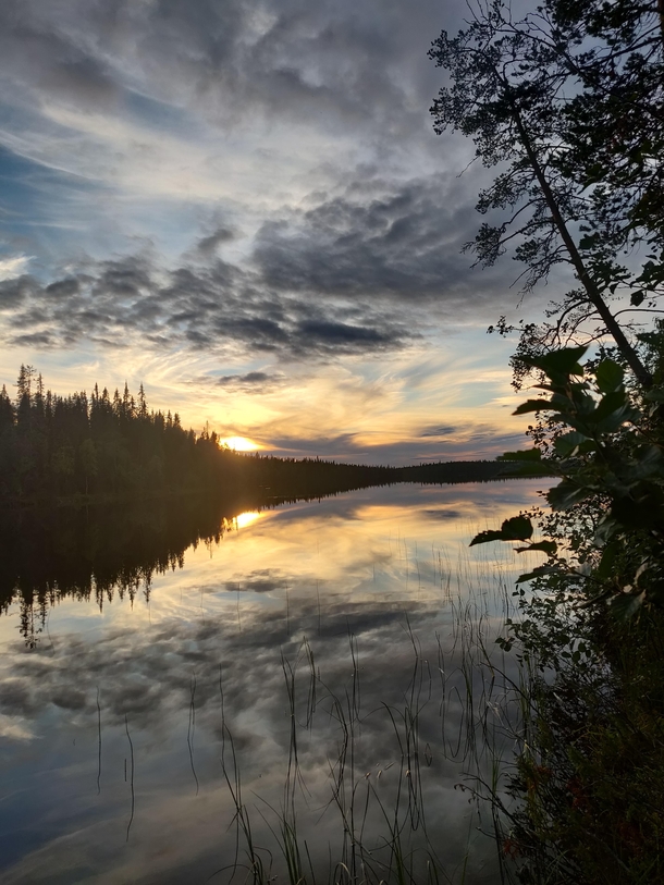 Sunset over a lake in Kuusamo Finland 