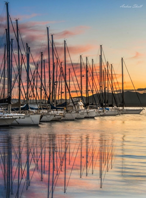 Sunset over the docks of Su Siccu Cagliari SardiniaItaly by Andrea Skull 