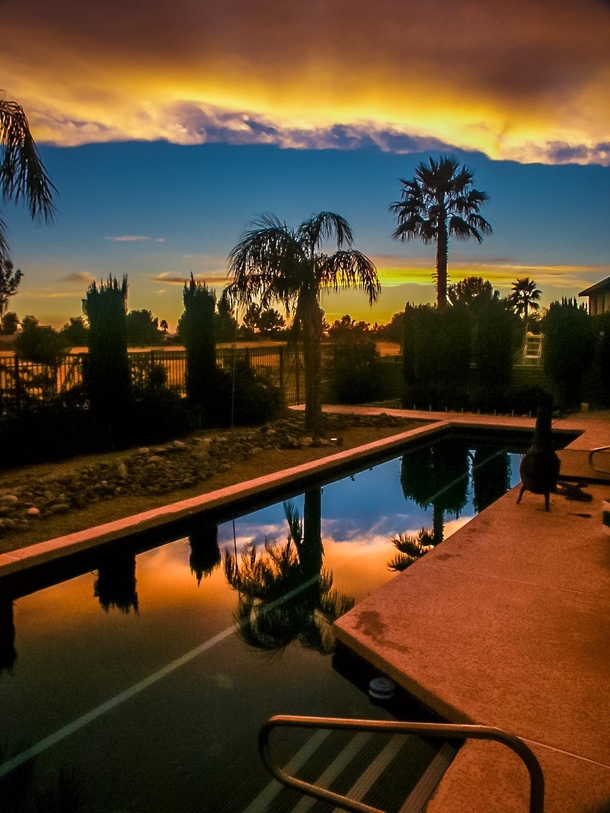 Sunset reflected in backyard pool - Yuma Arizona