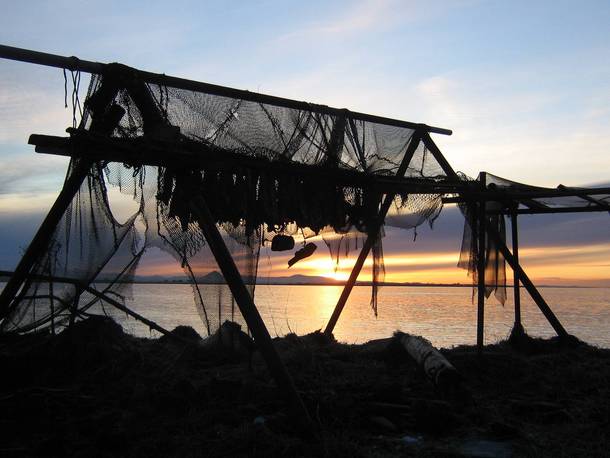 Sunset through abandoned fishing net Iceland  x