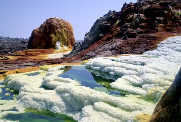 Surreal landscape at Dallol volcanic crater Ethiopia where hot springs are discharging brine and acid 