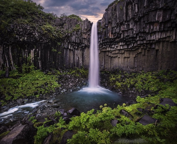 Svartifoss an Icelandic waterfall cutting through a columnar basalt formation  photo by freeezzzz x-post rIsland