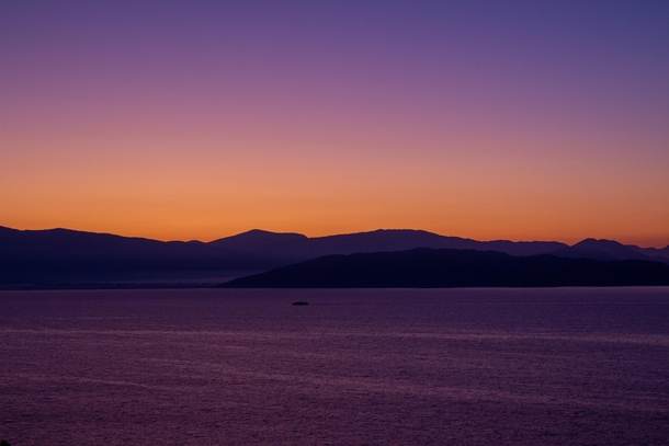 Taken at a beautiful sunrise in Nisaki Corfu The mountains shown are of mainland Greece 