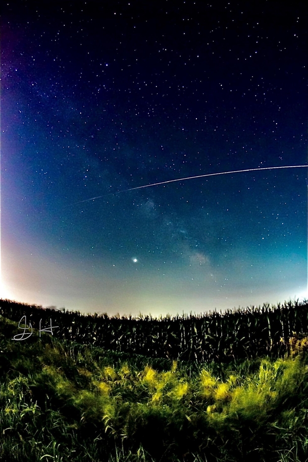 Thanks to clouds covering neowise I turned around and caught the luckiest shot ive ever captured Meteor over corn field Olathe Kansas