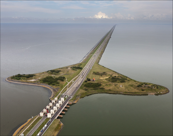 The Afsluitdijk English Closure Dike is a km mi long major causeway in the Netherlands and a fundamental part of the larger Zuiderzee Works Damming off the Zuiderzee a salt water inlet of the North Sea turning it into the fresh water IJsselmeer It opened 