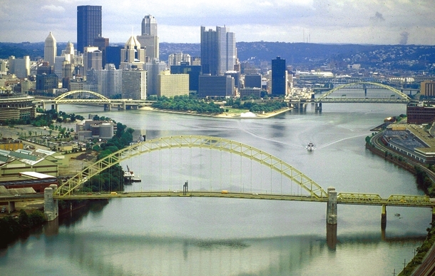 The Allegheny River left and Monongahela River join to form the Ohio River at Pittsburgh Pennsylvania the largest metropolitan area on the river 