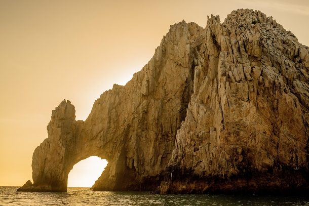 The beauty of the Arch of Cabo at sunset the very end of the peninsula with no people 
