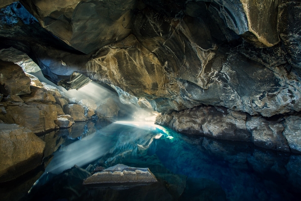The Blue Cave - the small lava cave of Grjtagj near Lake Mvatn Iceland  by Christian Biemann