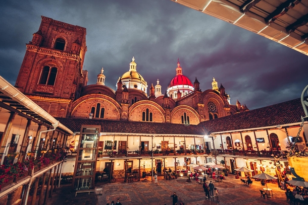 The Cathedral of Cuenca Ecuador lit up with the city colours