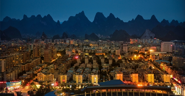 The city of Yangshao China with karst mountains in the background 