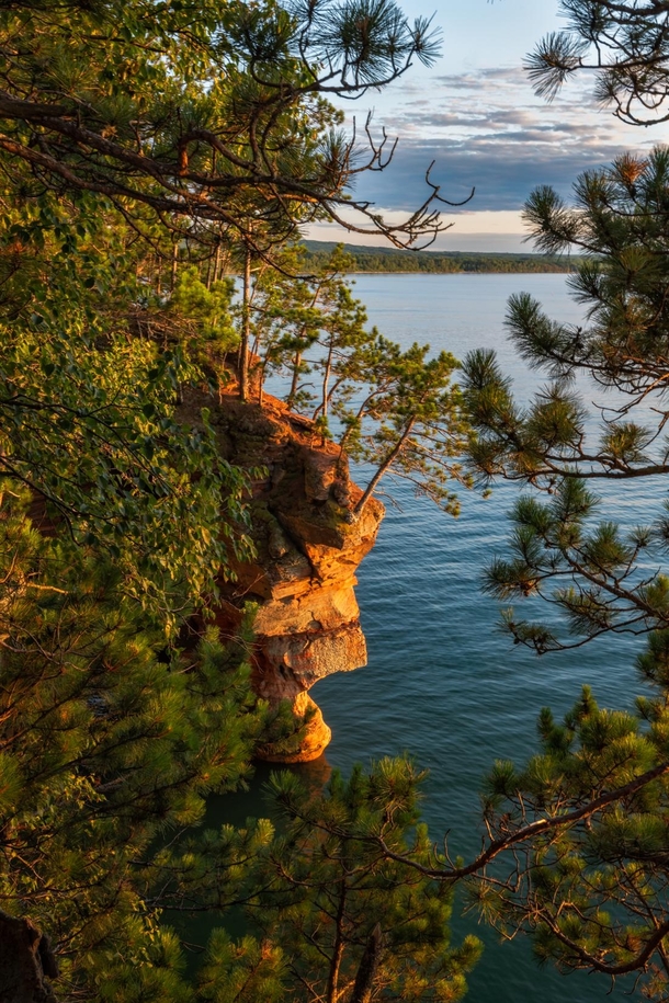 The cliffs of the Apostle Islands National Lakeshore glowing before sunset Wisconsin 