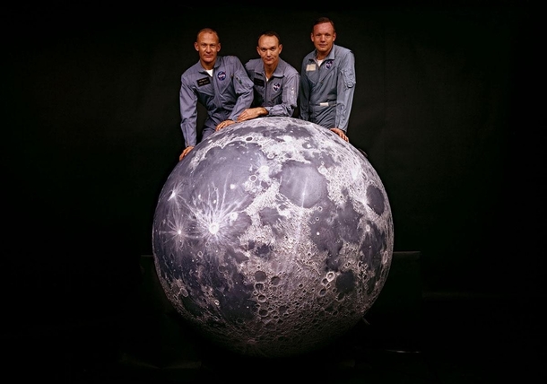 The crew of NASAs Apollo  mission behind a model of the moon in  Photo Ralph Morse 