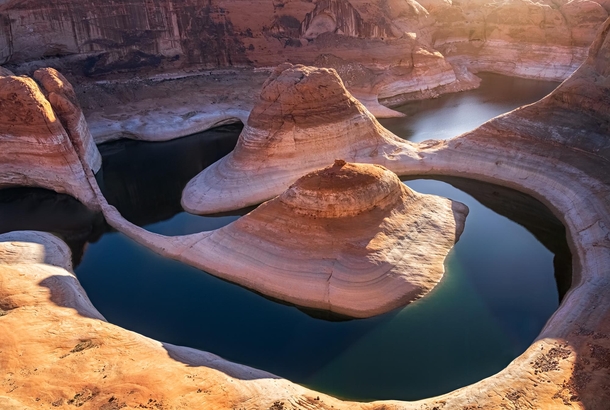 The curves of Lake Powell in Utah dappled with some soft morning light 