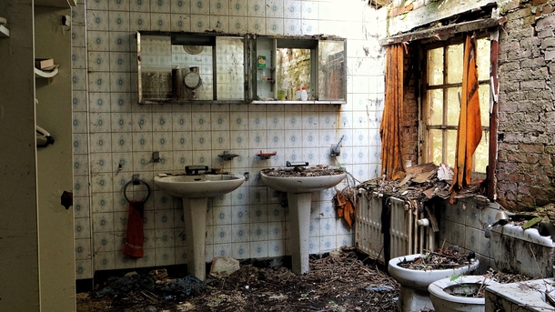 The decaying bathroom of an abandoned home somewhere in Belgium 