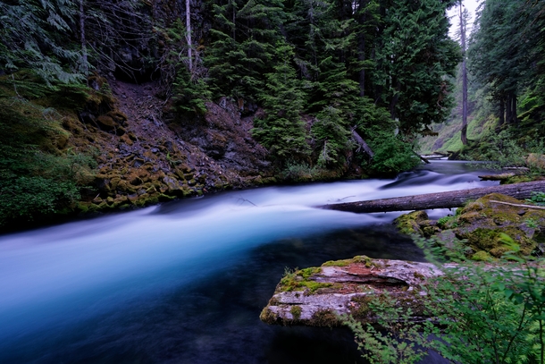 The deepest blue color Ive seen in a river McKenzie River Oregon at dusk 