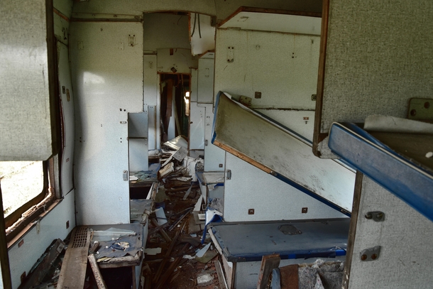 The destroyed insides of a reserved seat carriage on the abandoned Gaino-Kai railway station Lesnaya Russia