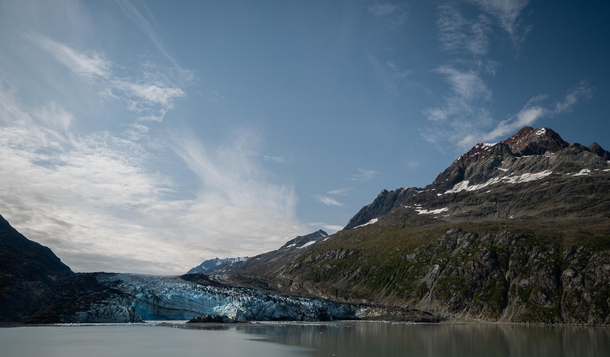 The dirt on the glacier is because it is slowly grinding away at the roots of the mountain carving its base out from under it Lampaugh Glacier Glacier Bay Alaska 